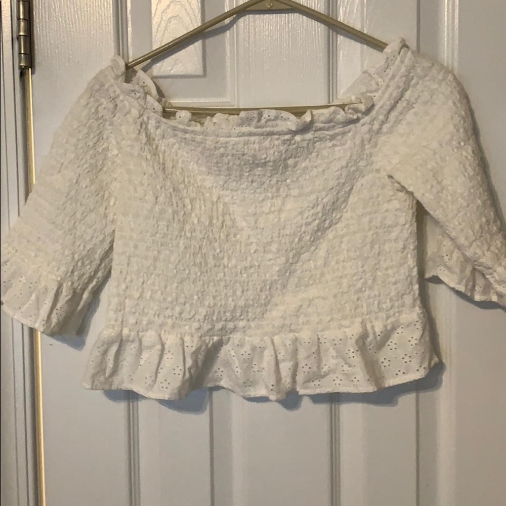 Smocked off the shoulder is white top
